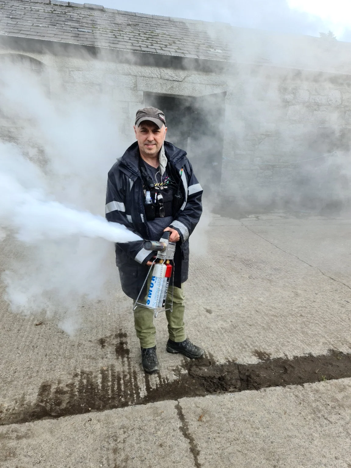 Special effects smoke operator working on set